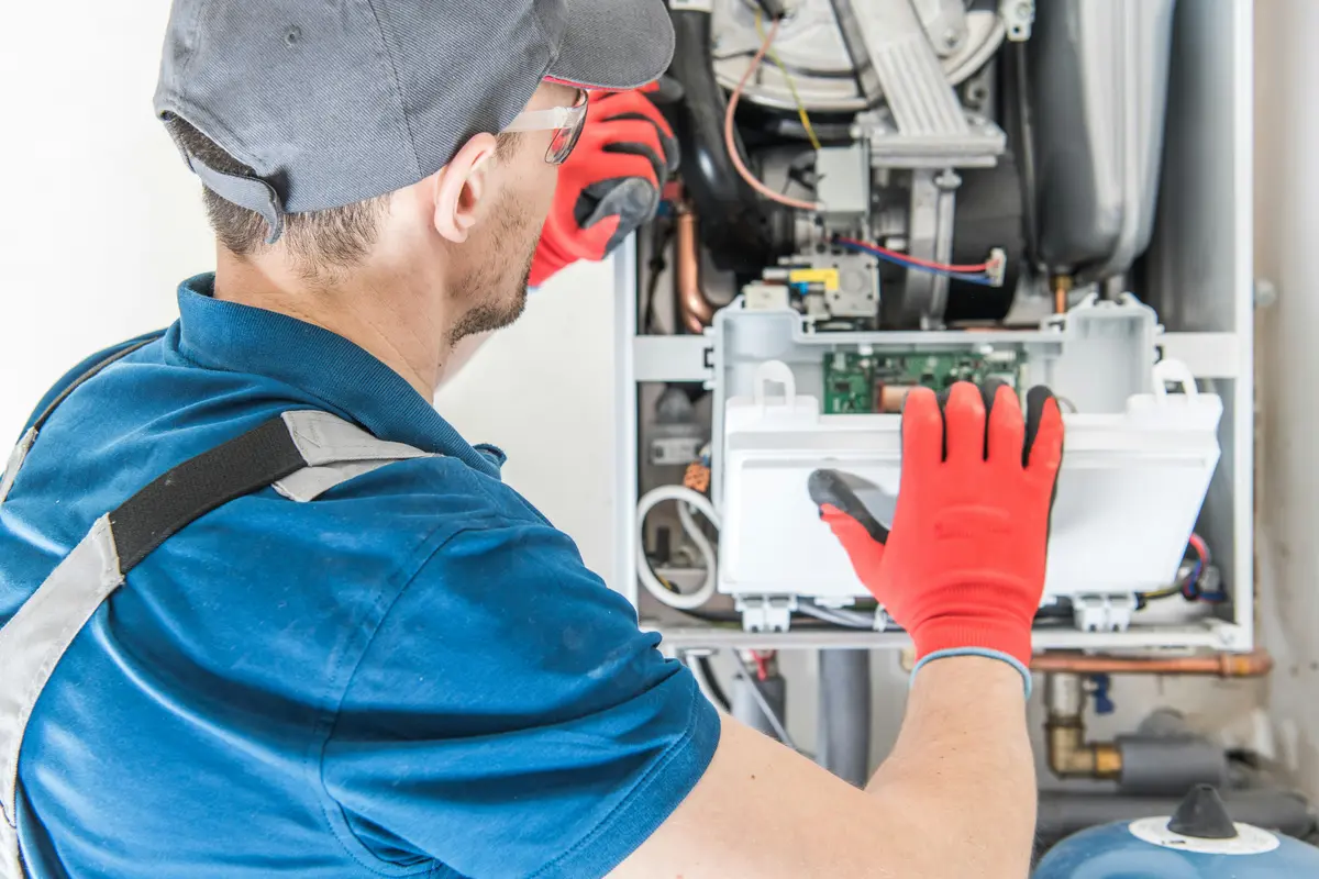 HVAC technician performing annual maintenance on a boiler in San Francisco