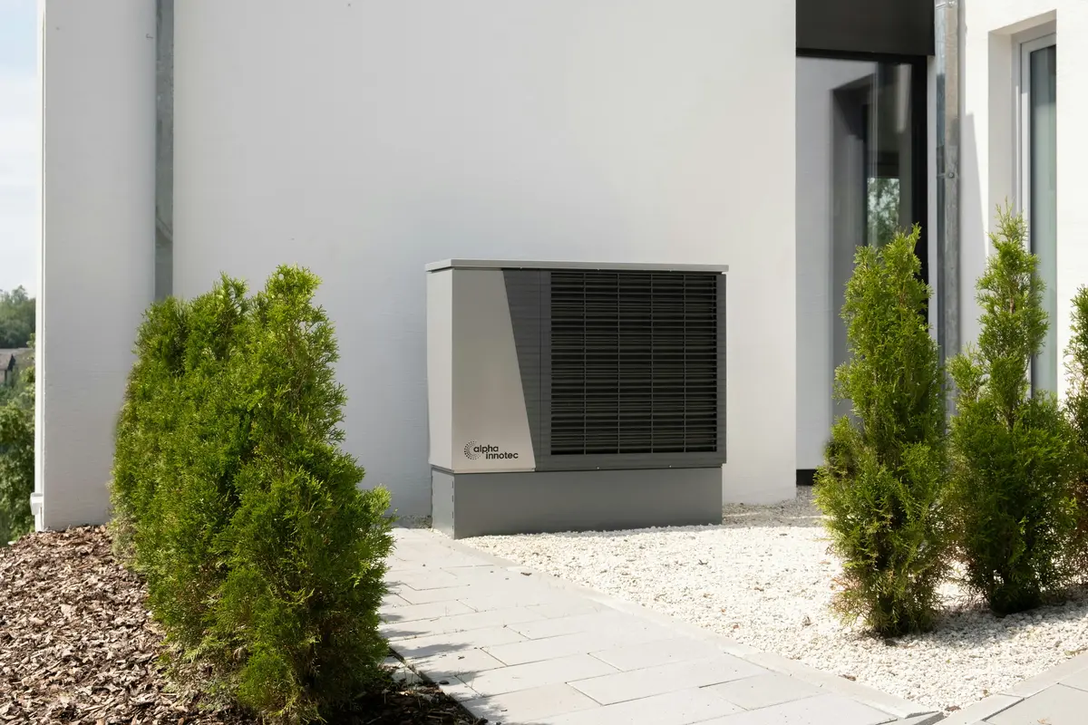 Cold-climate heat pump outdoor unit mounted on San Francisco home exterior